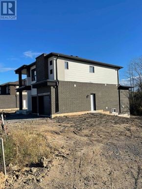 Welland (N. Welland) apartment for rent - A house under construction with a clear blue sky.