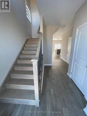 Welland (N. Welland) apartment for rent - A hallway with a staircase and a door on the right.