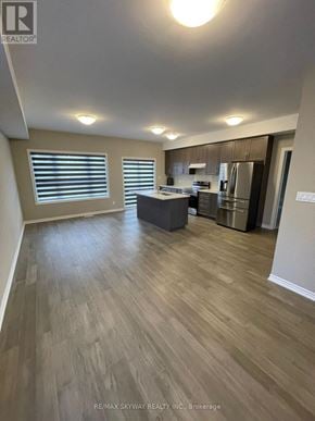 Welland (N. Welland) apartment for rent - A kitchen with a refrigerator, stove, and sink.