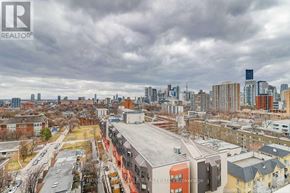 Toronto (Cabbagetown-South St. James Town) condo for rent - A cityscape with a cloudy sky and buildings of various heights.