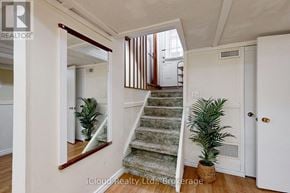 Brampton (Fletcher's West) apartment for rent - A room with a staircase and a mirror on the wall.