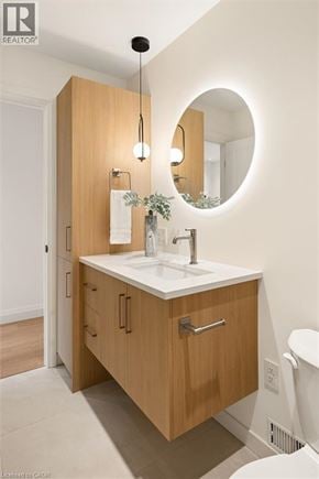 Kitchener apartment for rent - A bathroom with a sink and mirror.