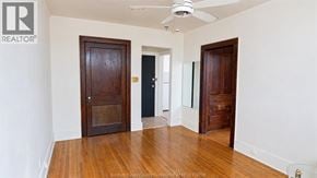 Windsor apartment for rent - A room with wooden floors and two doors.