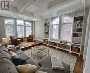 Toronto (Palmerston-Little Italy) duplex for rent - A living room with a grey sofa and a glass coffee table.