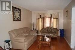 Mississauga (East Credit) apartment for rent - A living room with a couch, chair, and coffee table.