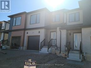 Brant (Paris) townhouse for rent - A row of houses with a sign that says sold in front of them.