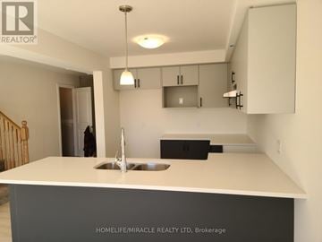 Brant (Paris) townhouse for rent - A kitchen with a sink and cabinets in a house.