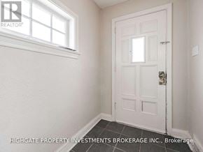 Toronto (Leaside) apartment for rent - A white door with a window above it in a room.