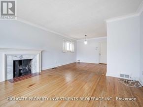 Toronto (Leaside) apartment for rent - A room with a fireplace and wooden floors.