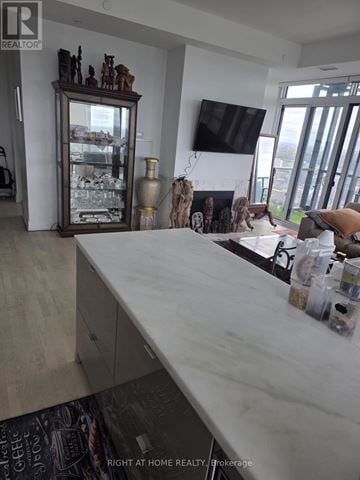 Toronto (Bay Street Corridor) condo for rent - A kitchen counter with a white marble top and a cabinet underneath.