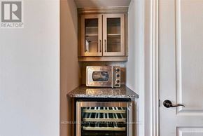 Toronto (Church-Yonge Corridor) condo for rent - A modern kitchen with a microwave oven and a toaster oven on a countertop.