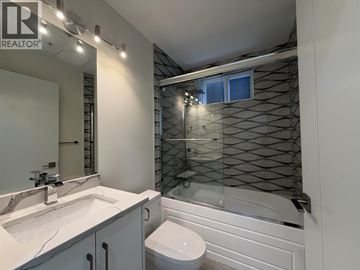 Vancouver apartment for rent - A bathroom with a white sink and toilet.