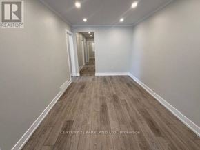 Toronto (Humbermede) apartment for rent - A long, narrow hallway with wood flooring and white walls.