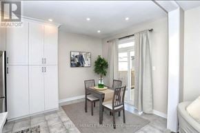 Brampton (Bram West) apartment for rent - A dining area with a table set for two and a plant on the table.