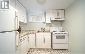 Oshawa (Mclaughlin) apartment for rent - A small kitchen with white appliances and cabinets.