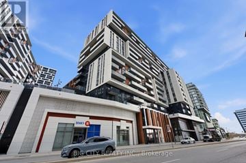 Markham (Unionville) condo for rent - A modern building with a car parked in front of it.