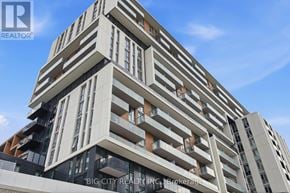 Markham (Unionville) condo for rent - A tall residential building with balconies on each floor.
