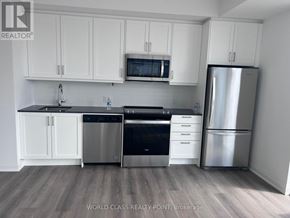 Vaughan (Beverley Glen) condo for rent - A kitchen with white cabinets and stainless steel appliances.