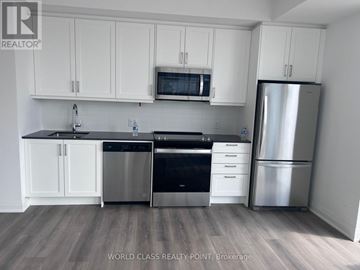 Vaughan (Beverley Glen) condo for rent - A kitchen with white cabinets and stainless steel appliances.