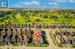 Bradford West Gwillimbury (Bradford) apartment for rent - A bird's eye view of a residential area with houses and a red pin marking a specific location.