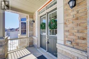 Bradford West Gwillimbury (Bradford) apartment for rent - A house entrance with a grey door and a wreath on it.