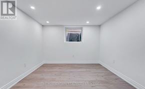 Thorold (Allanburg/Thorold South) apartment for rent - A room with a window and wooden flooring.