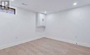 Thorold (Allanburg/Thorold South) apartment for rent - A room with white walls and wooden flooring, with a cabinet on the wall.