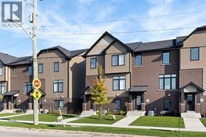 Lakeshore townhouse for rent - A new housing development with a REALTOR sign in front.