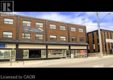 Kitchener apartment for rent - A building with a sign that says "REALTOR" on it.