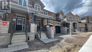 Cambridge townhouse for rent - A row of houses with a sign that says "Home".