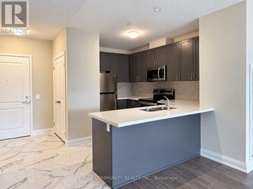 Whitchurch-Stouffville (Stouffville) condo for rent - A kitchen with a white countertop and a microwave above it.