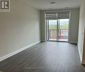 Whitchurch-Stouffville (Stouffville) condo for rent - A room with a sliding glass door leading to a balcony.