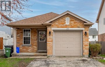Guelph (Kortright West) apartment for rent - A small brick house with a grey garage door is for sale.