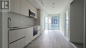 Toronto (Mount Pleasant West) condo for rent - A modern kitchen with a microwave above the stove.