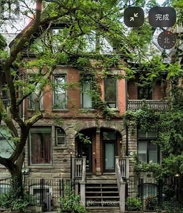 Toronto (Moss Park) townhouse for rent - A large house with a tree in front of it.