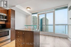 Toronto (Waterfront Communities) condo for rent - A kitchen with a view of the city.