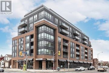 Toronto (Greenwood-Coxwell) condo for rent - A large multi-story building with a glass facade and a brown exterior.