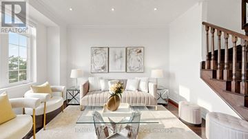 Markham (Victoria Square) townhouse for rent - A living room with a glass coffee table and a staircase.