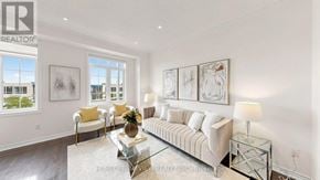 Markham (Victoria Square) townhouse for rent - A well-lit living room with a sofa, armchair, and a coffee table.