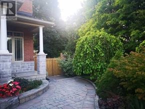 Vaughan (Sonoma Heights) apartment for rent - A stone walkway leads to a house with a porch.