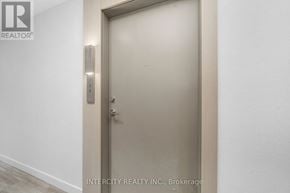 Brampton (Bram East) condo for rent - A door with a handle and a lock is closed.