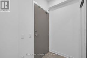 Brampton (Bram East) condo for rent - A white door in a room with a sign that says Intercity Realty Inc Brokerage.