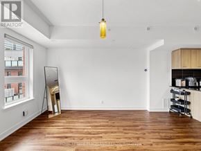 Toronto (L'amoreaux) townhouse for rent - A room with wooden floors and a large window.