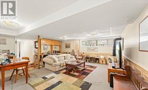 King (King City) apartment for rent - A living room with a couch, chair, and rug.