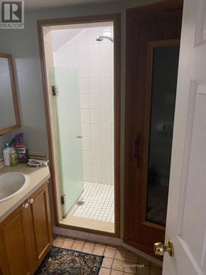 King (King City) apartment for rent - A bathroom with a glass shower door and a sink.