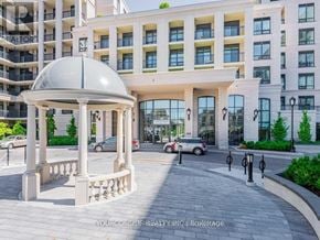 Markham (Unionville) condo for rent - A gazebo is in front of a building with a sign that says "BEAUTIFUL".