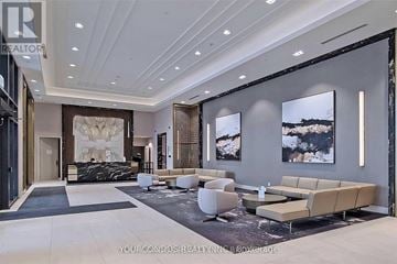Markham (Unionville) condo for rent - A spacious living room with a large marble table and a long sofa.