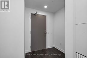 Brampton (Bram East) condo for rent - A room with a closed door and a logo on the wall.