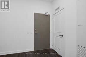Brampton (Bram East) condo for rent - A room with a white door and a brown door.