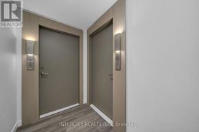 Brampton (Bram East) condo for rent - Two elevator doors with the logo INTERCITY REALTY INC. Brokerage on the wall.